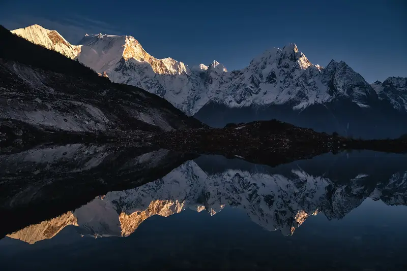 The Manaslu range reflected in a lake